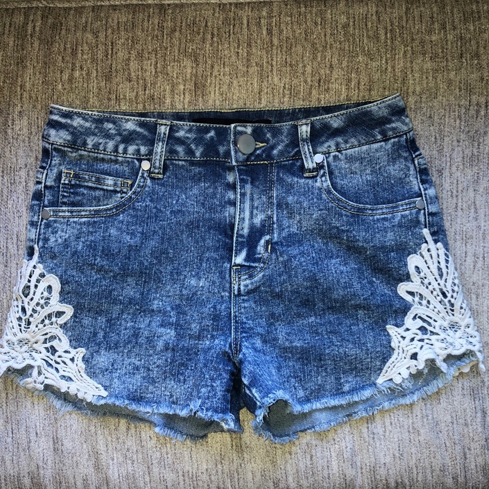 Vintage Medium Wash Denim Shorts with Lace Trim and Bleached Distressed Style